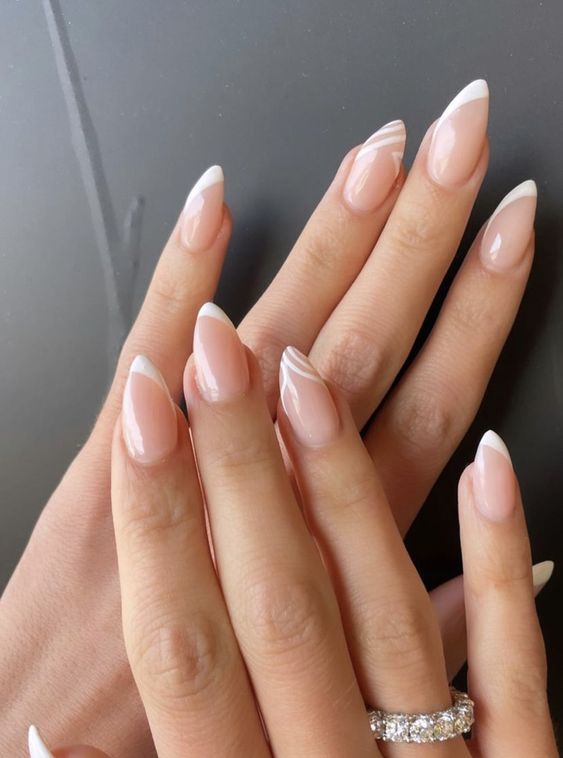 pointed French nails with one side tips and swirl nails as accent ones will be a trendy alternative to usual French ones
