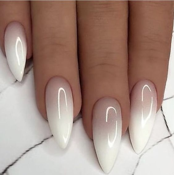 Pointed nails with an ombre French manicure with lots of white is a very eye catchy and cool solution