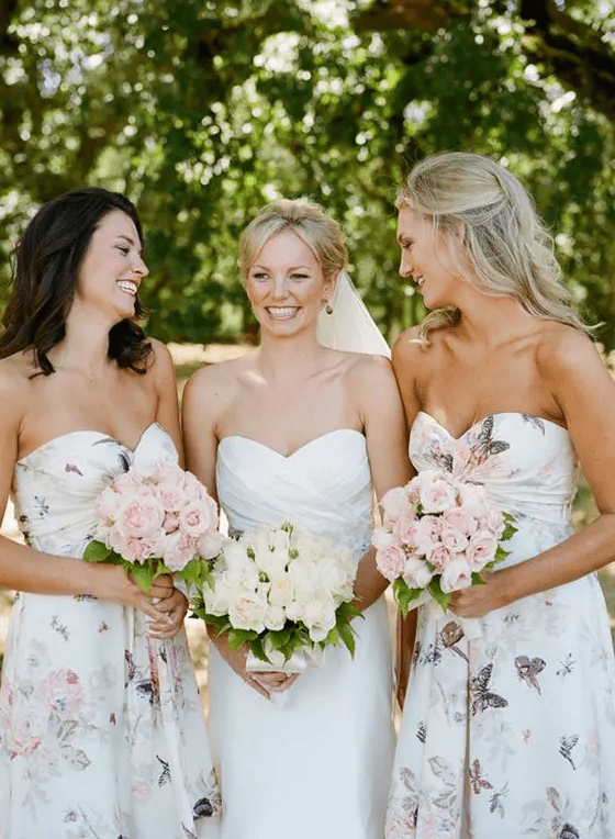 pretty strapless butterfly and flower print maxi bridesmaid dresses with draped bodices are a lovely idea for a spring or summer wedding
