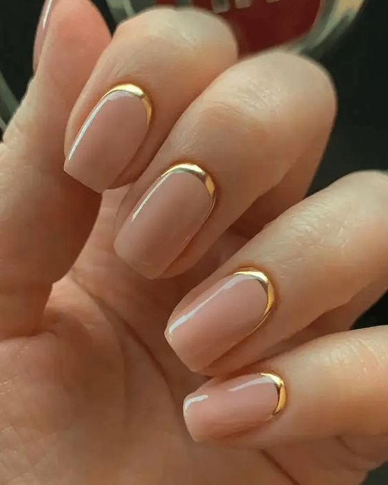 sophisticated reverse French nails with shiny gold touches are amazing to look chic, stylish and glam