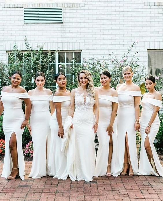 sophisticated white off the shoulder maxi bridesmaid dresses with slits and nude shoes are perfect for a wedding