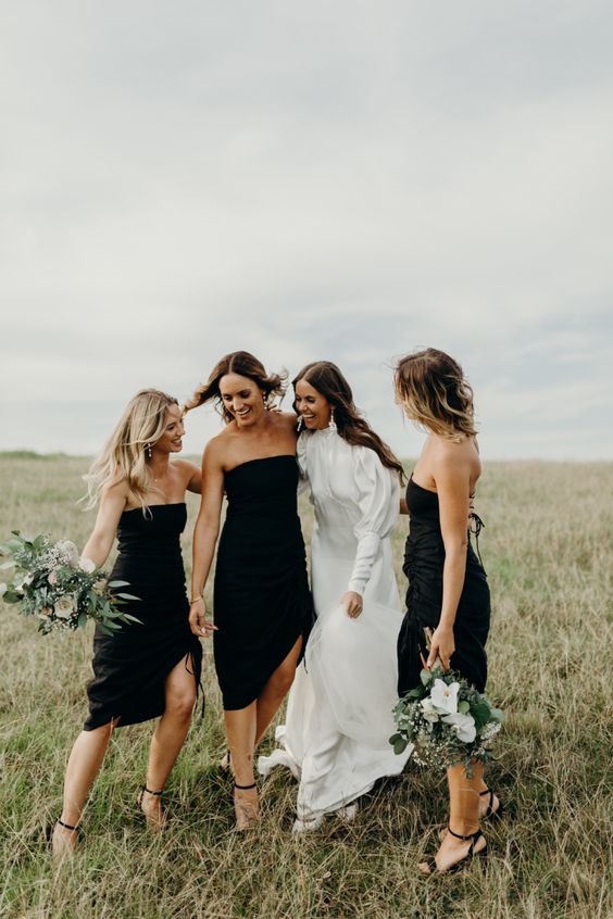 stylish and sexy strapless midi bridesmaid dresses, black heels and greenery and white bloom bouquets