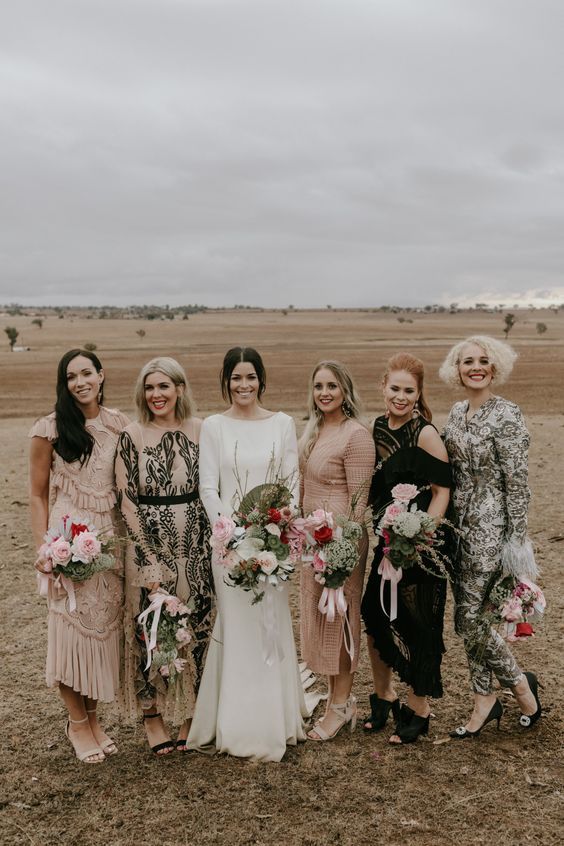 stylish mix and match maxi bridesmaid dresses with tassels, fringe and abstract prints for a boho wedding