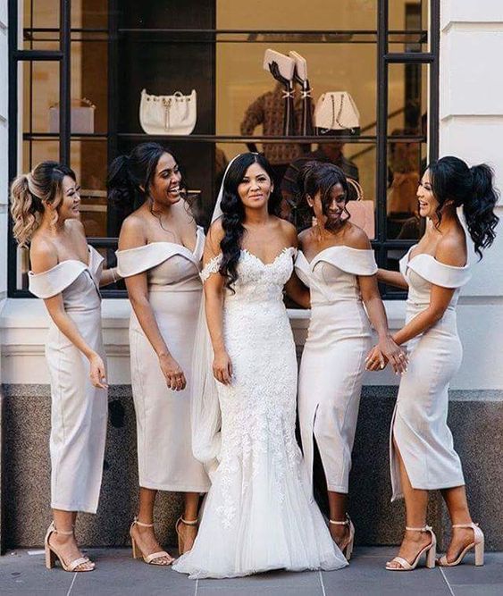 stylish off the shoulder white midi bridesmaid dresses with accented necklines and nude shoes for spring or summer