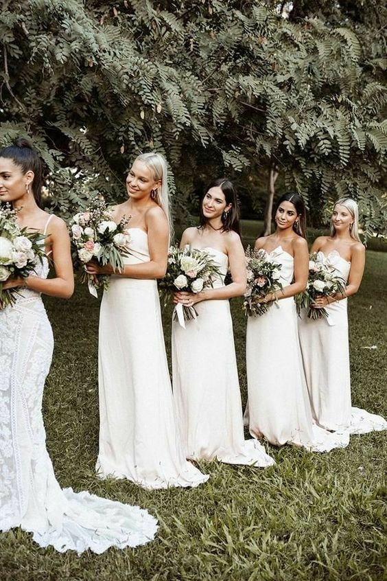 white strapless maxi bridesmaid dresses with draped bodices and trains are amazing for a chic spring or summer wedding