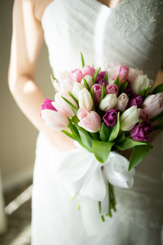 a bold and chic wedding bouquet of white, blush, pink and purple tulips is an amazing idea for a spring wedding with a touch of color