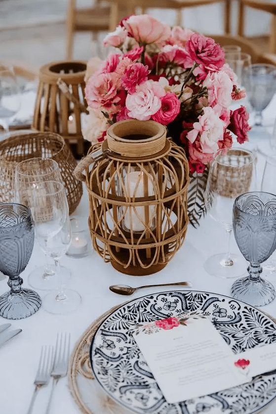 a colorful wedding centerpiece of blush, pink and hot pink carnations and other blooms is a cool idea for a bold wedding