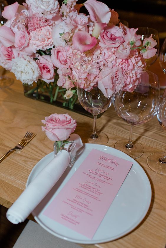 a pink wedding centerpiece of pink hydrangeas, roses and callas is a romantic and chic idea for any wedding with pink shades