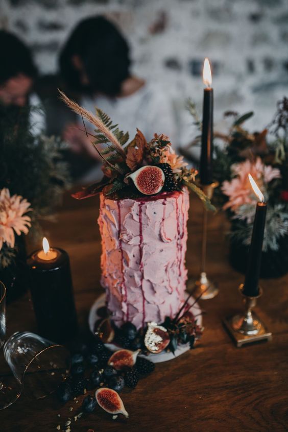 a textural pink wedding cake with figs and blackberries, greenery and grasses for a decadent fall wedding