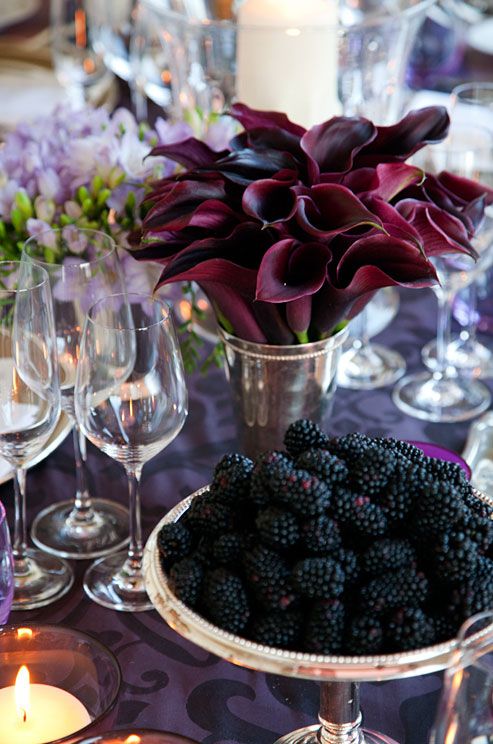 an elegant and refined deep purple calla wedding centerpiece is a timeless idea for a moody wedding