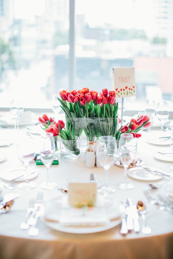 an extra bold red tulip wedding centerpiece is a cool and catchy idea for a modern bright wedding in any season
