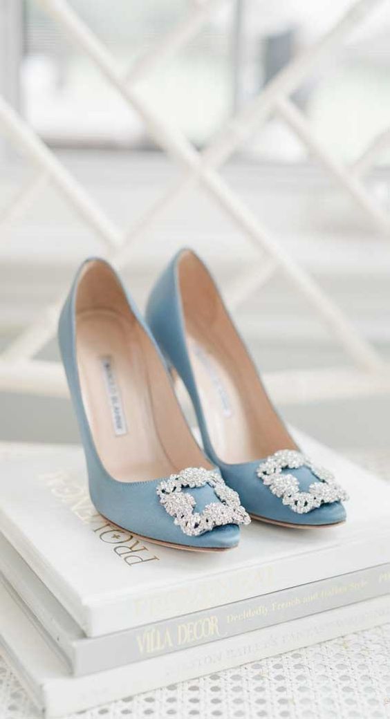 blue Manolo Blahnik wedding shoes with embellished buckles are a cool idea for any bridal look