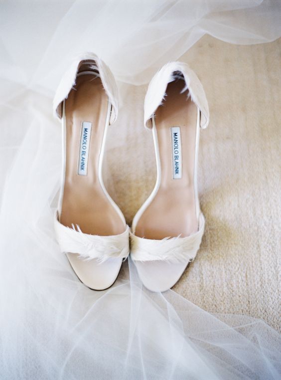 delicate white wedding shoes with feathers are a stylish idea to add glam but just a little bit