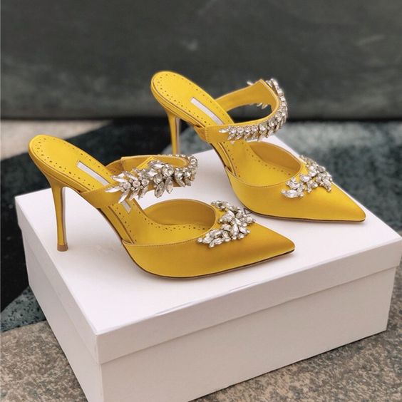 edgy and chic embellished lemon yellow mules with straps and high heels will make your look fashion-forward