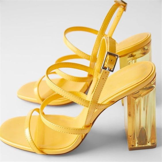 Edgy strappy yellow shoes with sheer block heels are a jaw dropping idea for a summer wedding