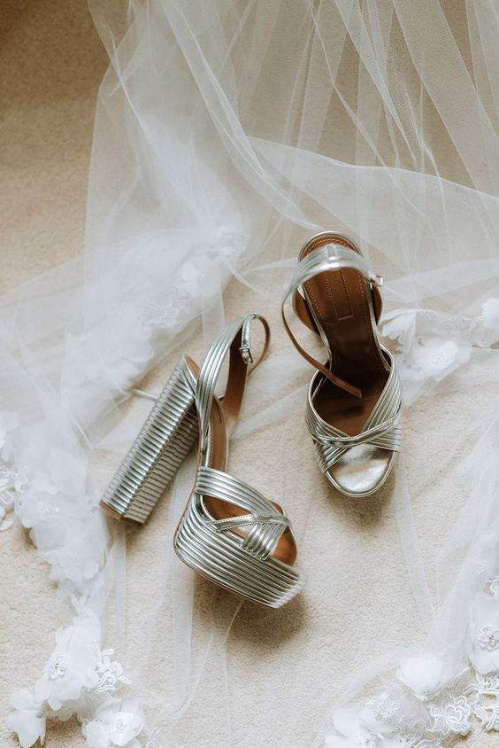 extra bold silver platform wedding shoes with very high heels are a fantastic statement for a wedding