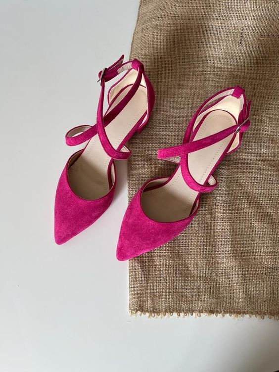 fuchsia wedding flats with criss cross straps are a cool solution for a bold bridal loo, they look chic and trendy