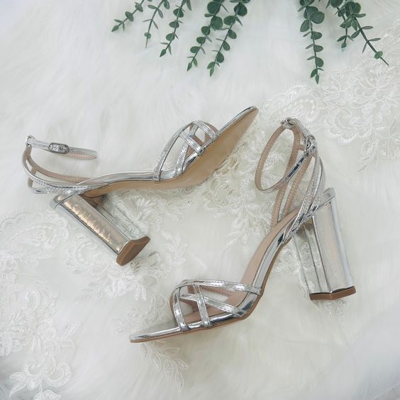 glam shiny silver strappy wedding shoes with high yet comfortable heels are amazing for a spring or summer wedding