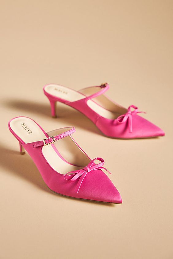 hot pink pointed toe wedding mules with kitten heels and small bows plus Mary Jane style straps are great
