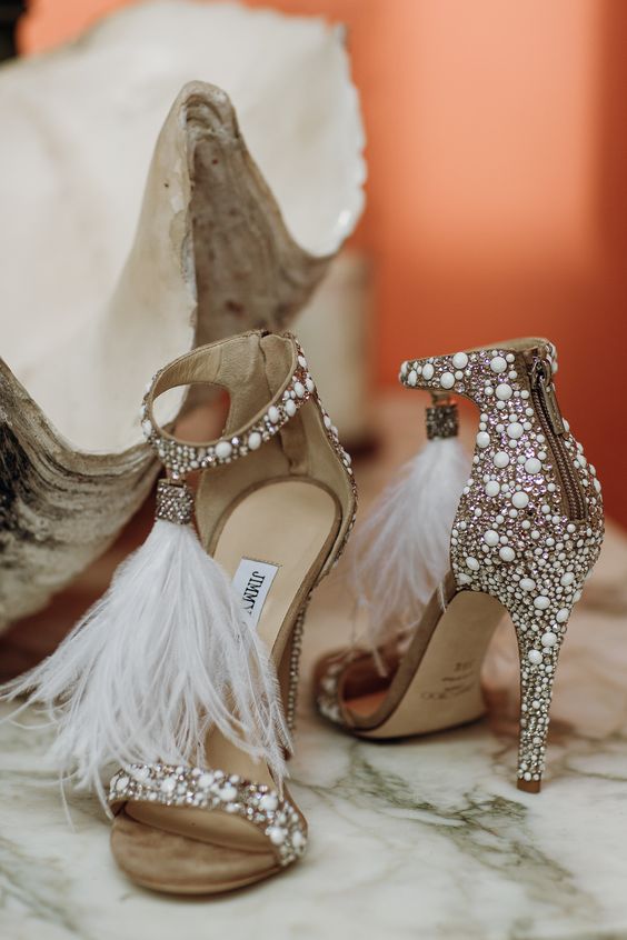jaw-dropping embellished wedding shoes with feather tassels will make a statement at the wedding