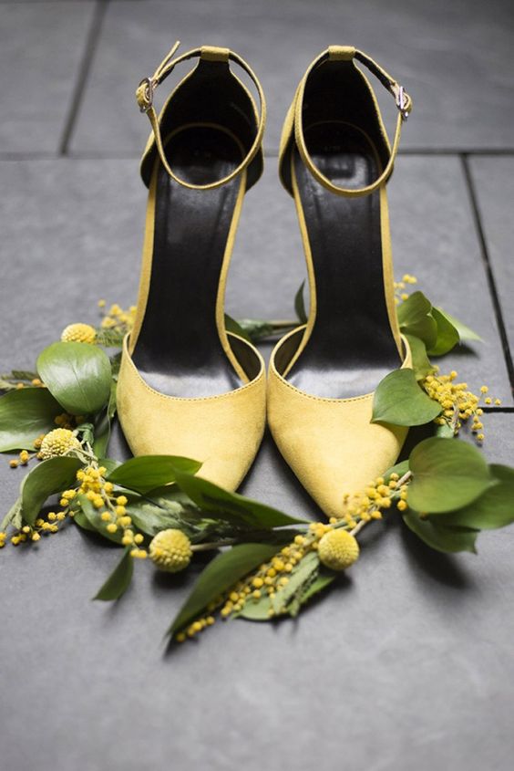 lemon yellow suede shoes with high heels and ankle straps are chic and refined, perhaps not very comfy for walking