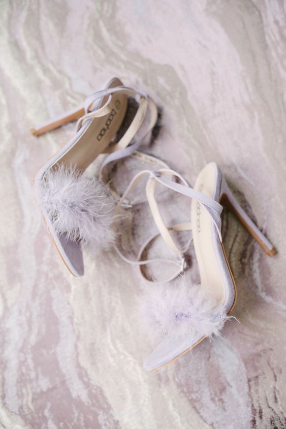 lilac wedding shoes with high heels and feathers are a cool and cute addition to the bridal look