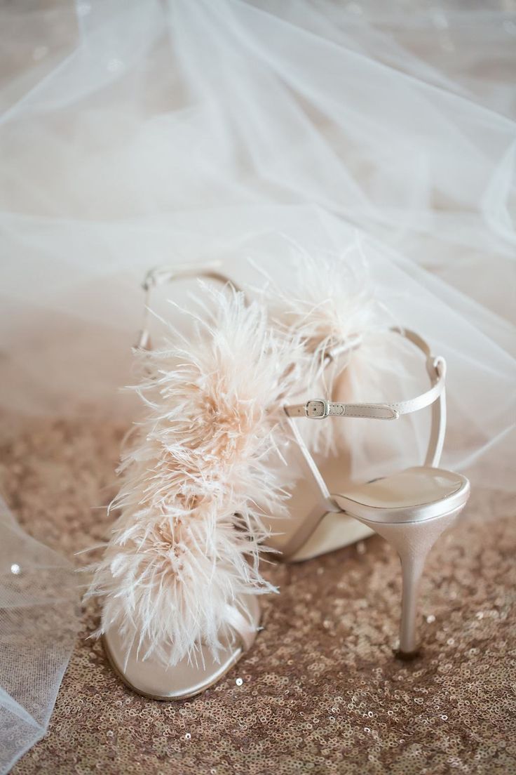 neutral wedding shoes with high heels and blush feathers are amazing for a chic and refined bridal look