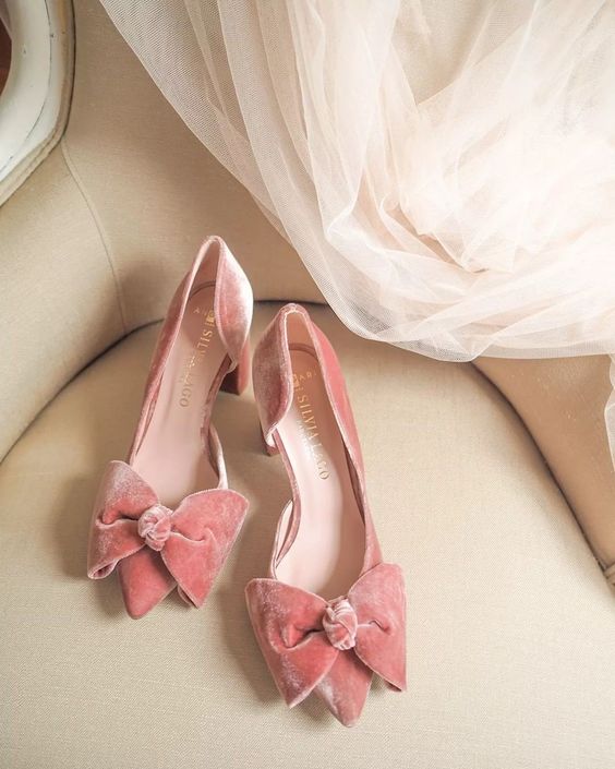 peachy pink velvet wedding shoes with large bows are a super cute and girlish idea for any bridal look