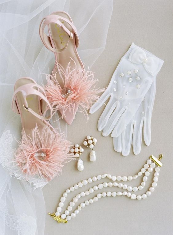 pink wedding shoes with feathers and clear beads are amazing for a chic and pretty bridal look