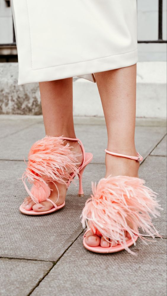 pink wedding shoes with feathers and comfy heels are amazing for a chic and glam look, and they will add a touch of color