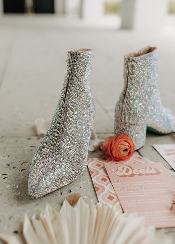 shiny glam silver wedding boots with not very high heels are a cool and chic solution for a wedding