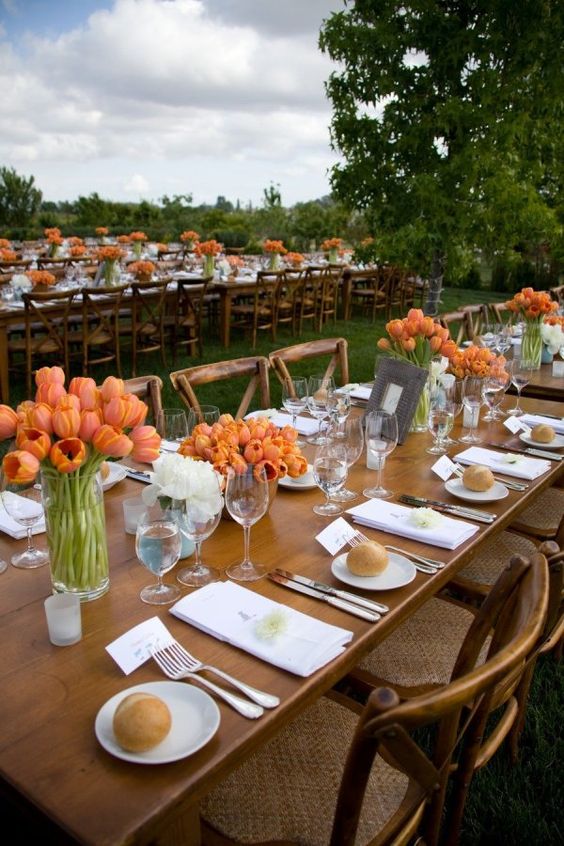 super bold orange tulip centerpieces instantly bring color to the space and make it feel a bit more fall-like