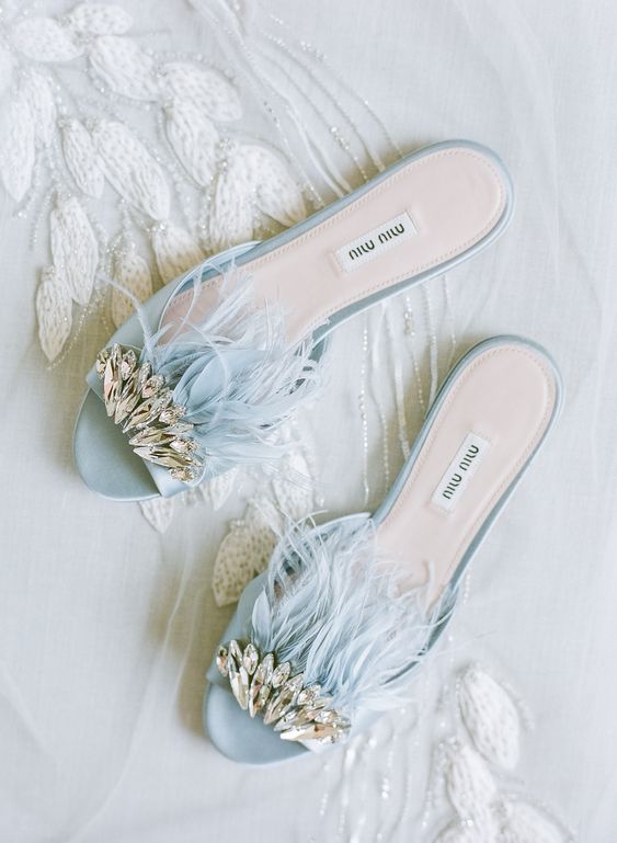 trendy pastel blue mules with crystals and feathers are amazing for spring and summer weddings