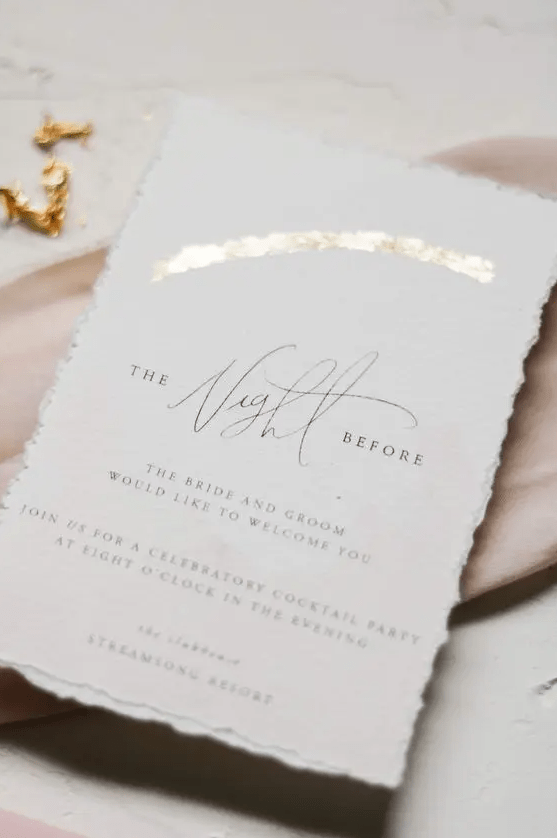a beautiful neutral handmade paper invitation with gold foil and calligrpahy is a cool idea for a stylish modern neutral wedding