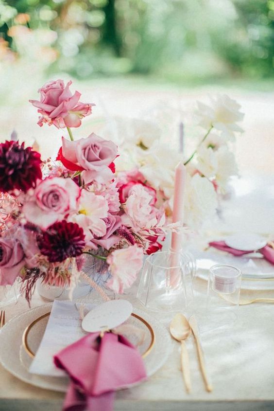 a beautiful wedding centerpiece of blush, lilac and white roses and burgundy dahlias is a stunning idea for a summer weddig
