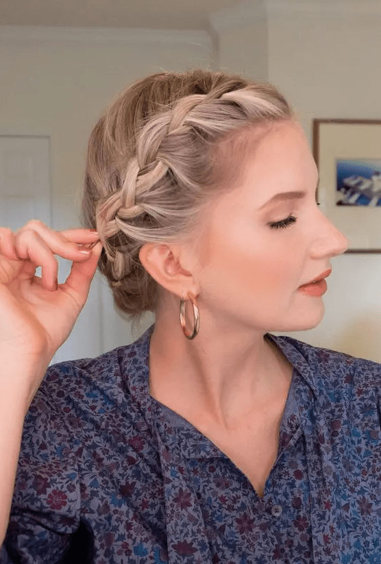 a blonde bob styled with a crown braid, which is a cool braided updo for short hair, it looks cute