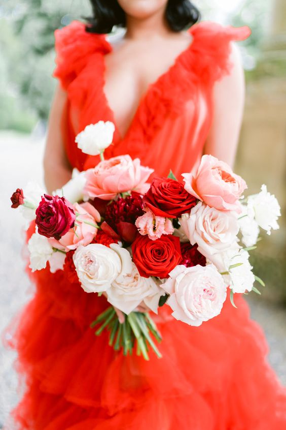 a bright wedding bouquet of white, blush and red roses with no greenery is a super cool solution for modern brides