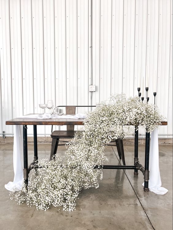a cascading white baby's breath wedding centerpiece is a super chic idea for a modern wedding, and it's quite easy to make