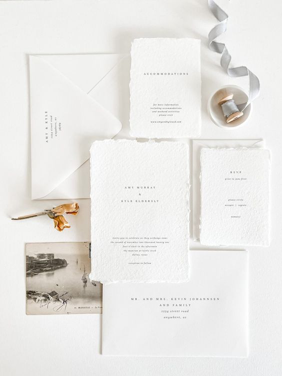 a chic modern wedding invitation suite with usual and textured paper, black lettering is a stylish idea for a modern wedding