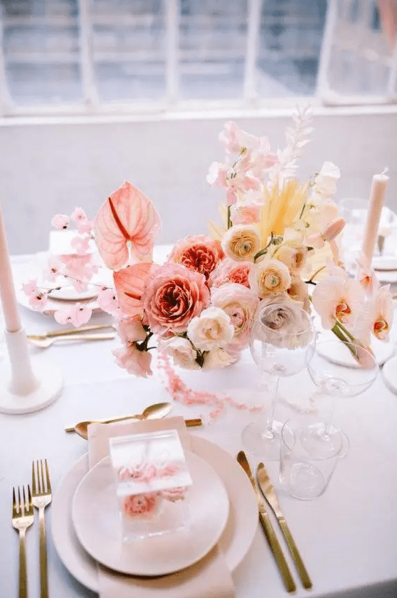 a chic ombre floral wedding centerpiece from pink to blush and yellow is a very refined idea that will make a statement and bring a spring feel