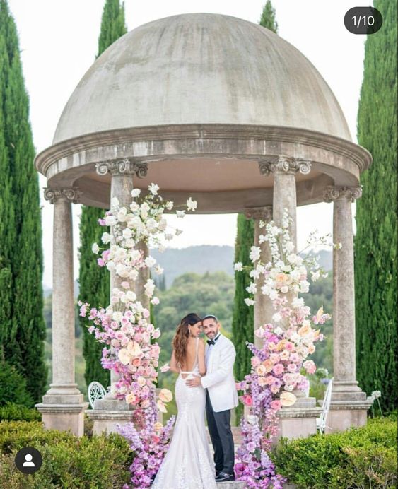 a creative ombre wedding arch from lilac to blush and ivory is a gorgeous idea for a summer garden wedding