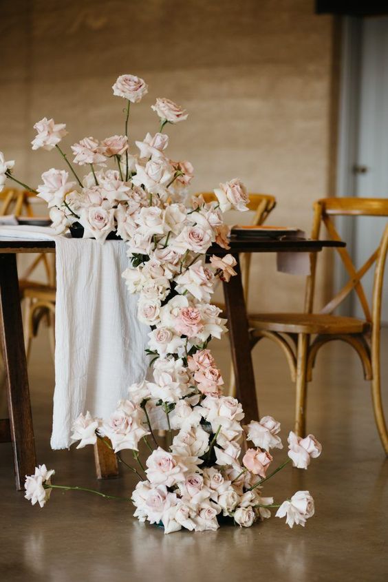 a delicate cascading blush rose wedding centerpiece is an amazing and refined decoration for any neutral wedding