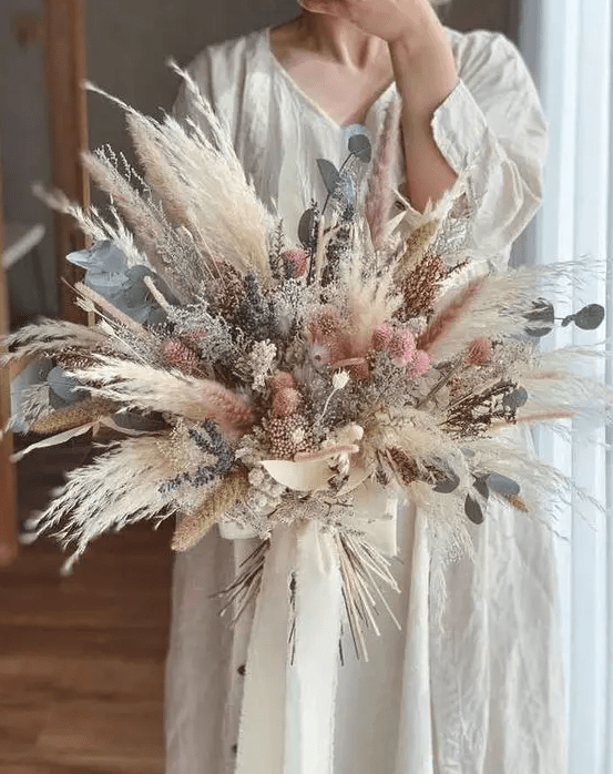 a dreamy dried flower wedding bouquet with pampas grass, lavender, allium, eucalyptus and some dried grasses is a lovely idea for spring or summer