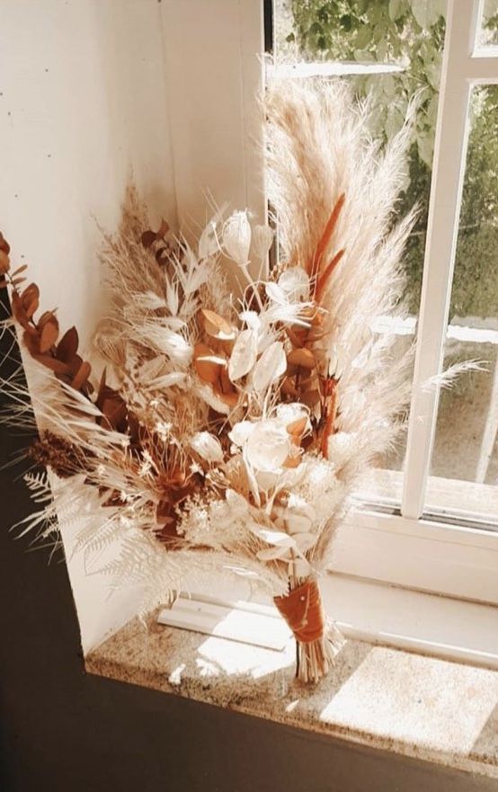 a fall wedding bouquet of dried foliage, pampas grass and some lunaria and grasses is a lovely idea for a wedding