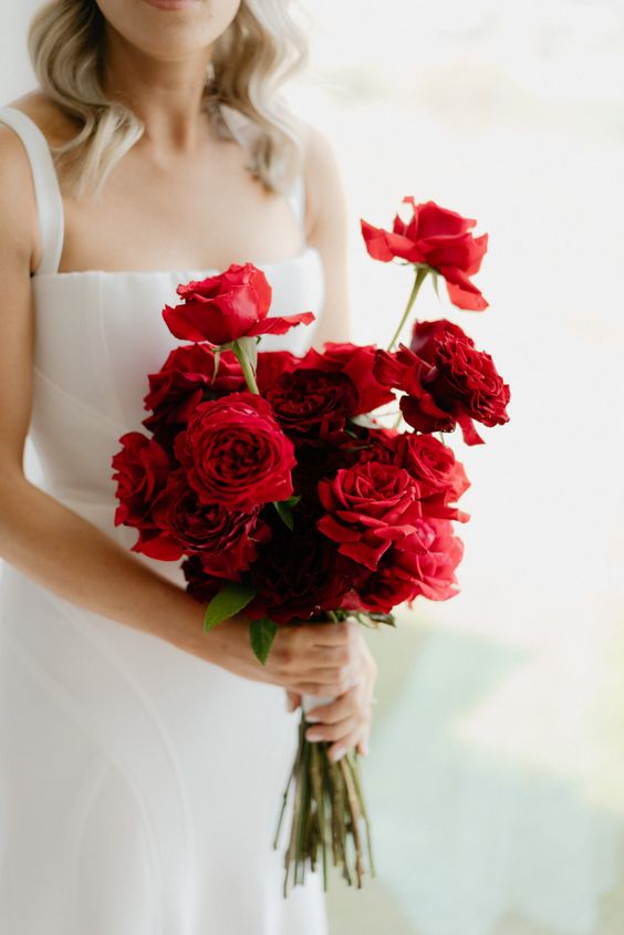 A long stem red rose wedding bouquet is a fresh take on classics, it looks timeless yet very up to date