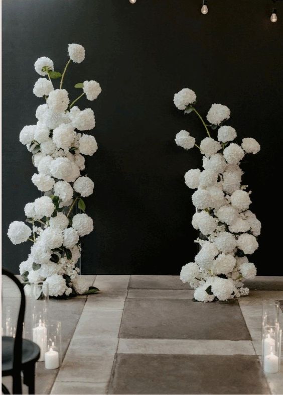 a modern wedding altar composed of white hydrangeas is a cool idea for a modern or minimalist wedding
