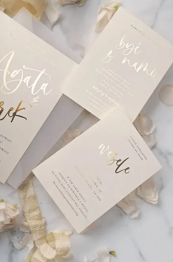 a cute invitation suite with golden calligraphy