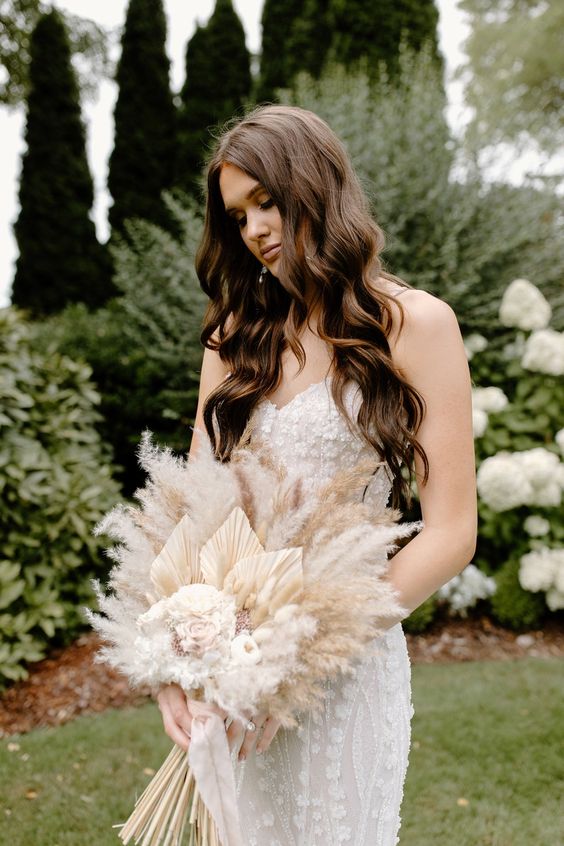 a neutral wedding bouquet of pampas grass, neutral roses and fronds is a cool idea for a spring wedding or just a boho neutral one