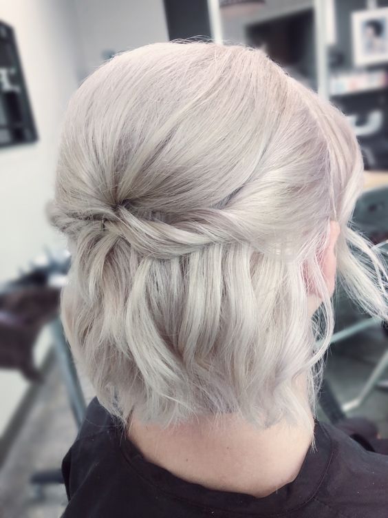 a platinum blonde half updo with a bump on top, some twists and straight hair down is a great idea