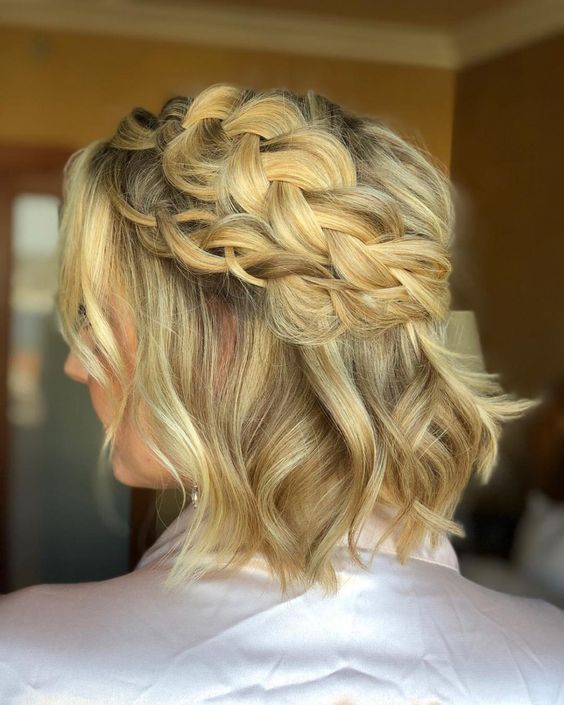 a short blonde half updo with a double loose braided halo and waves down is a cool hairstyle for a wedding
